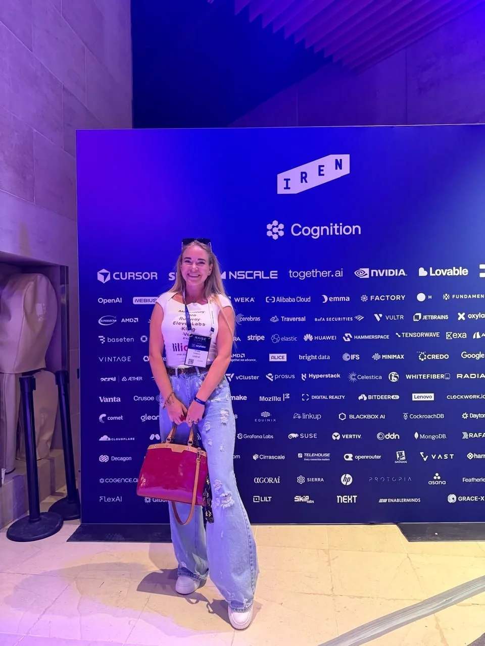 Tetiana Stepanets at the RAISE Summit sponsor wall in Paris.