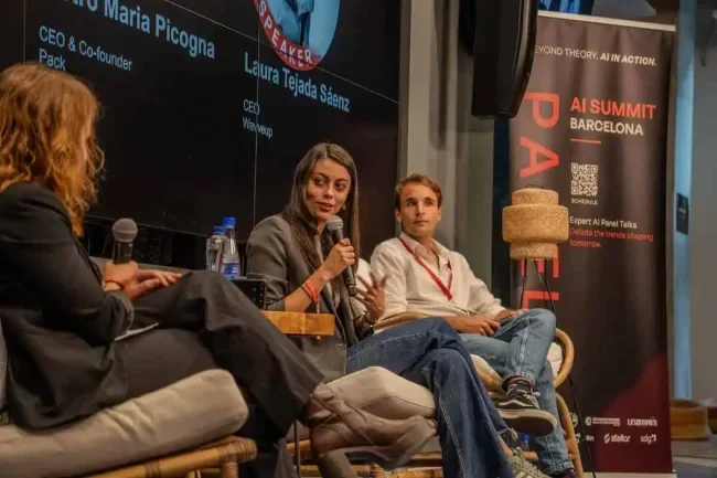 Panel discussion on stage at AI Summit Barcelona